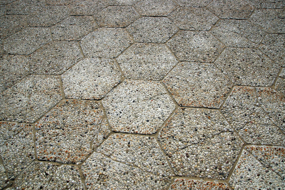 Close-up view of hexagonal stone pavement showcasing textures and patterns.