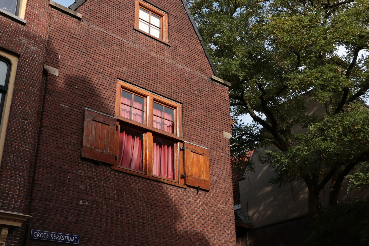 Historic brick building with wooden windows in Leeuwarden, Friesland.